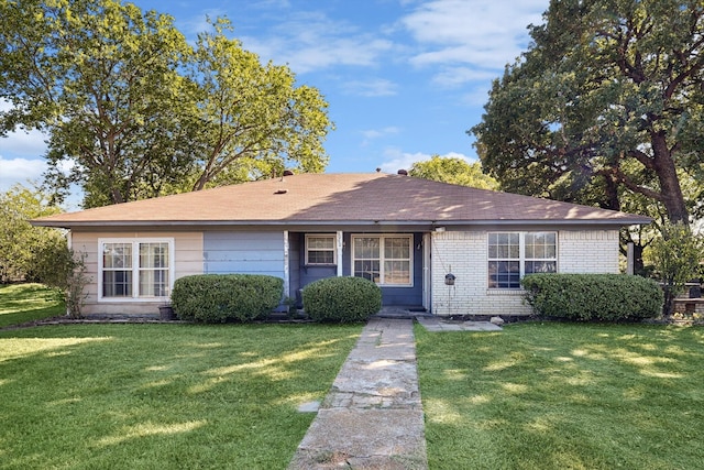 view of front of property with a front lawn