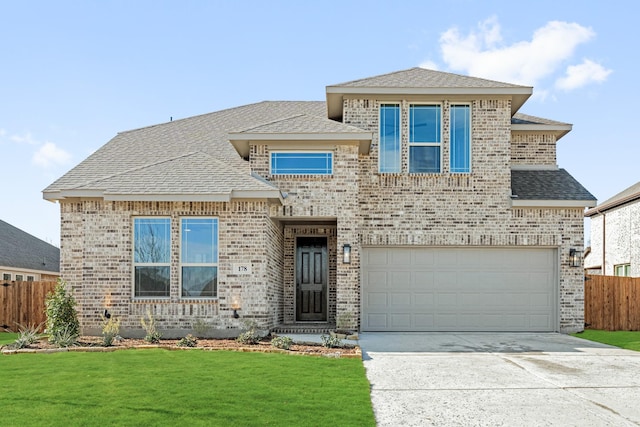 view of front facade with a front lawn and a garage