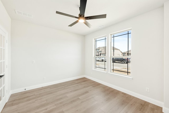 spare room with ceiling fan and light hardwood / wood-style flooring