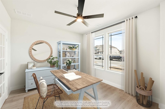 spare room with ceiling fan, french doors, and light hardwood / wood-style flooring