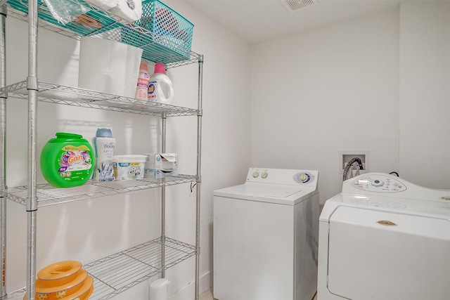 laundry room featuring washing machine and dryer