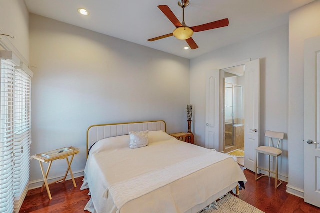 bedroom with ensuite bath, ceiling fan, and dark hardwood / wood-style flooring