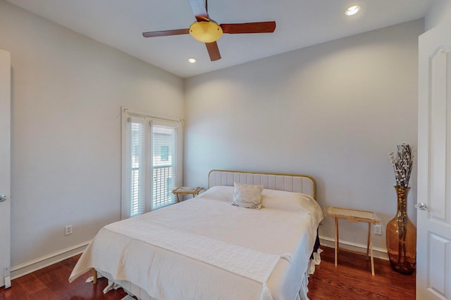 bedroom featuring dark hardwood / wood-style flooring and ceiling fan