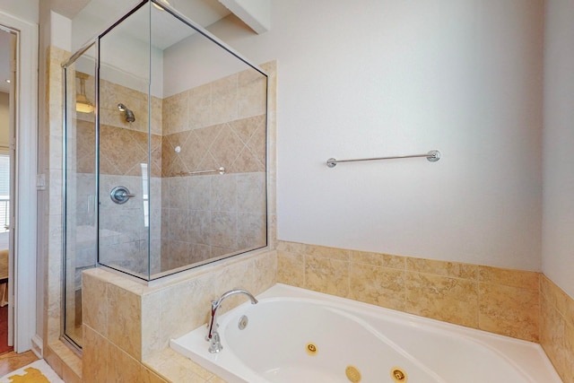 bathroom featuring a relaxing tiled tub