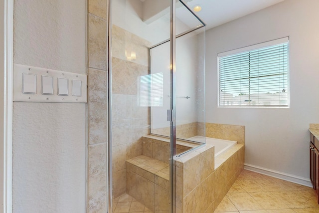 bathroom featuring separate shower and tub, vanity, and tile patterned floors