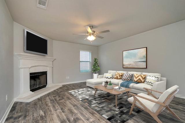 living room with ceiling fan and dark hardwood / wood-style floors