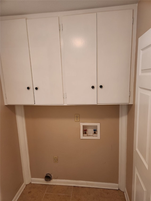 laundry room featuring hookup for a washing machine, tile patterned flooring, hookup for an electric dryer, and cabinets