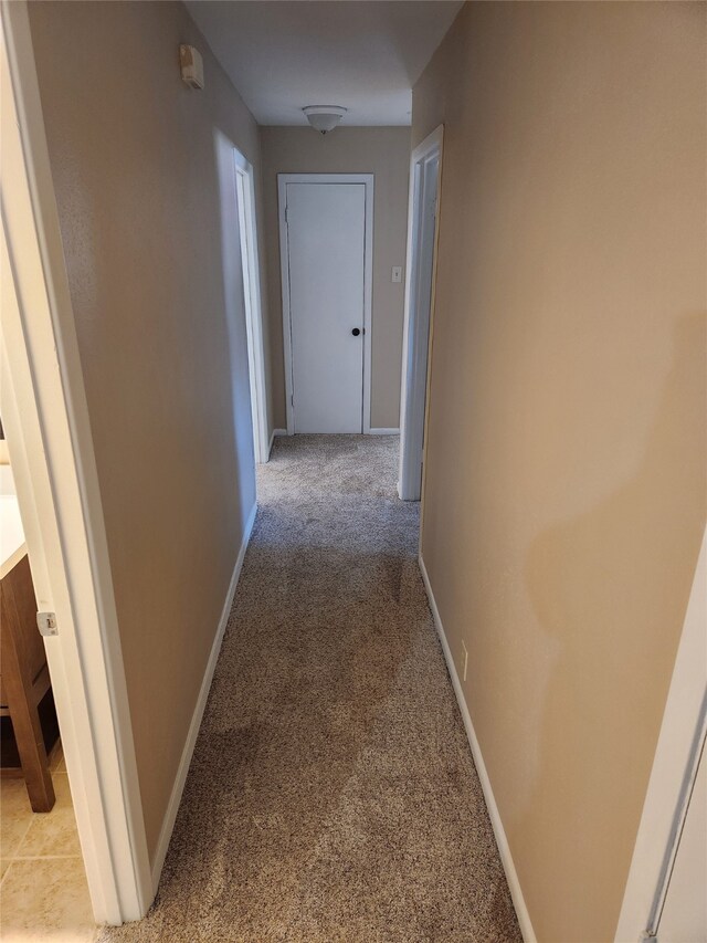 hallway with light carpet