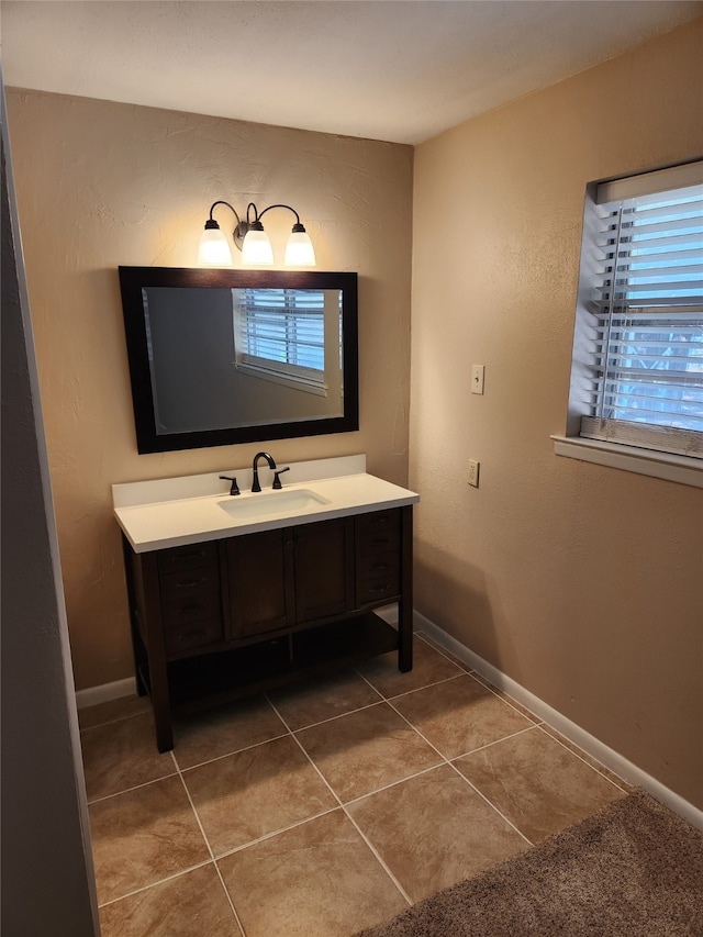 bathroom featuring tile patterned floors and vanity