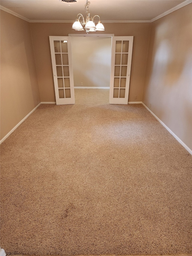 carpeted empty room with french doors, a notable chandelier, and crown molding