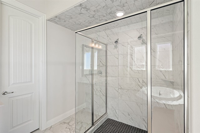 bathroom with a shower with shower door