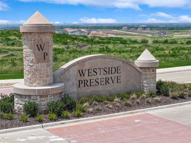 community sign featuring a rural view