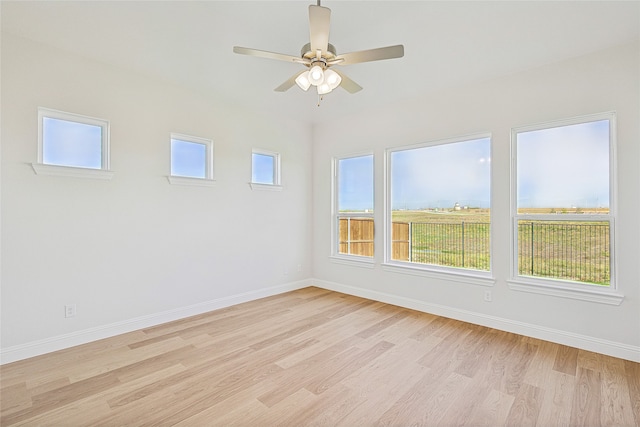 empty room featuring light hardwood / wood-style flooring and ceiling fan