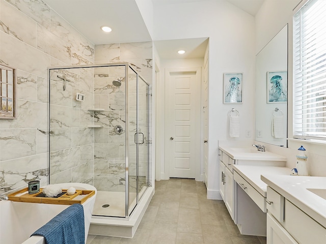 bathroom featuring vanity and a shower with door