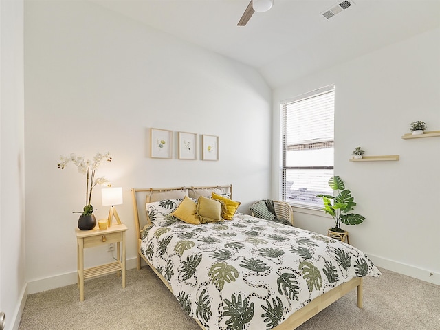 bedroom featuring vaulted ceiling, ceiling fan, and carpet flooring