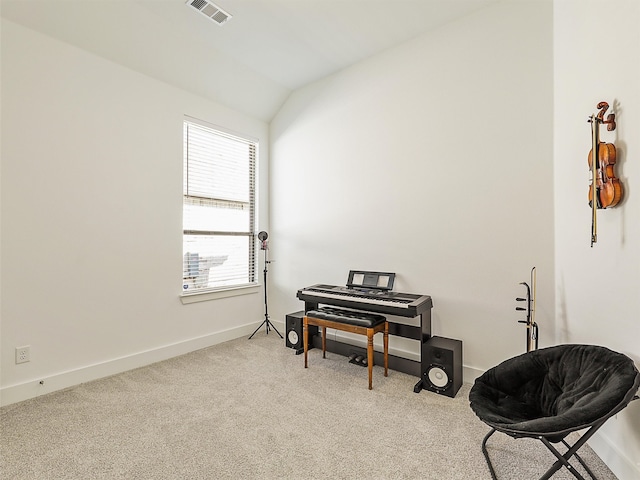 misc room featuring lofted ceiling and light colored carpet