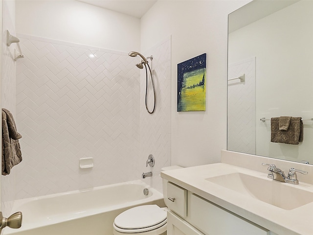 full bathroom featuring toilet, vanity, and tiled shower / bath