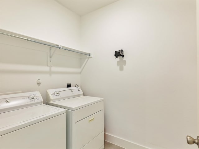 laundry room featuring separate washer and dryer