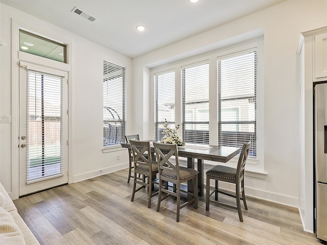 dining area with light hardwood / wood-style flooring