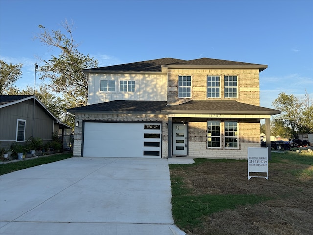 view of front of property featuring a garage