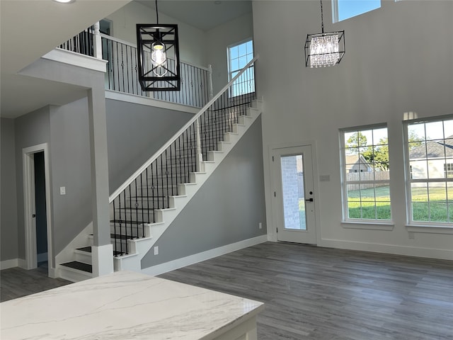 interior space featuring a notable chandelier, hardwood / wood-style floors, sink, and a wealth of natural light