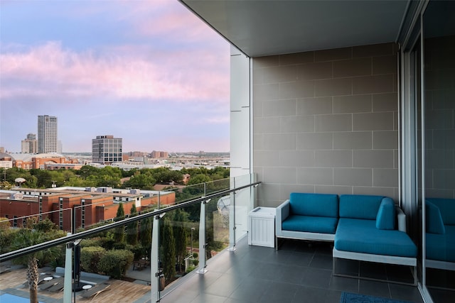 balcony at dusk with an outdoor hangout area