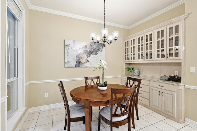 tiled dining space with an inviting chandelier and crown molding