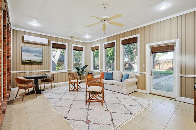 sunroom featuring ceiling fan and a wall mounted air conditioner