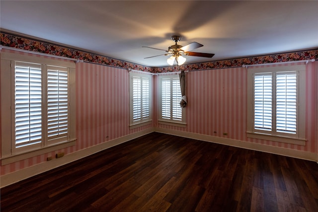 empty room with hardwood / wood-style floors and ceiling fan