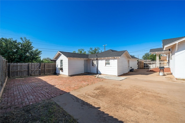 rear view of house featuring a patio