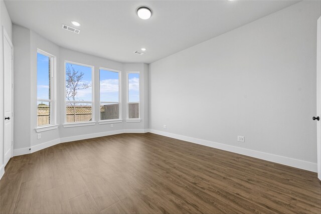 empty room with wood-type flooring