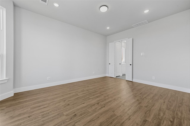 spare room with wood-type flooring