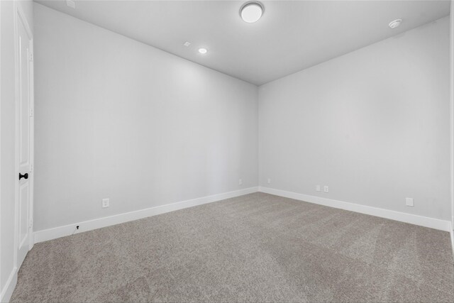 unfurnished room featuring carpet