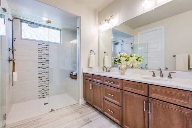 bathroom with vanity and an enclosed shower