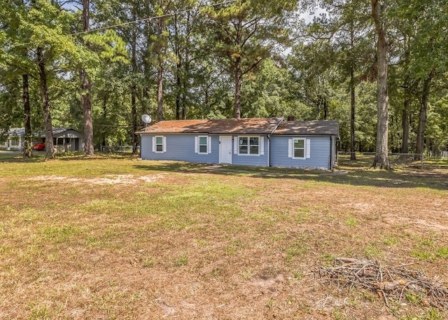 ranch-style home featuring a front yard