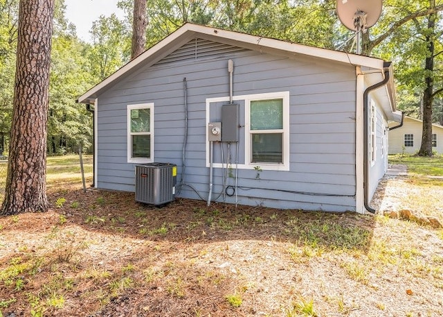 view of side of property with central AC