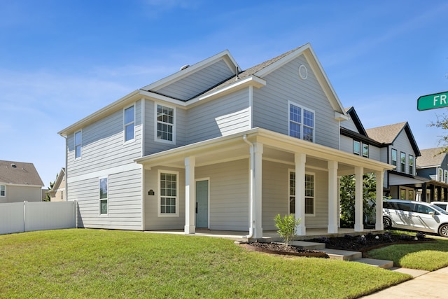 view of front facade featuring a front lawn and a porch