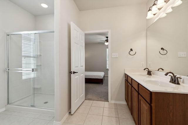 bathroom with tile patterned flooring, vanity, ceiling fan, and a shower with shower door