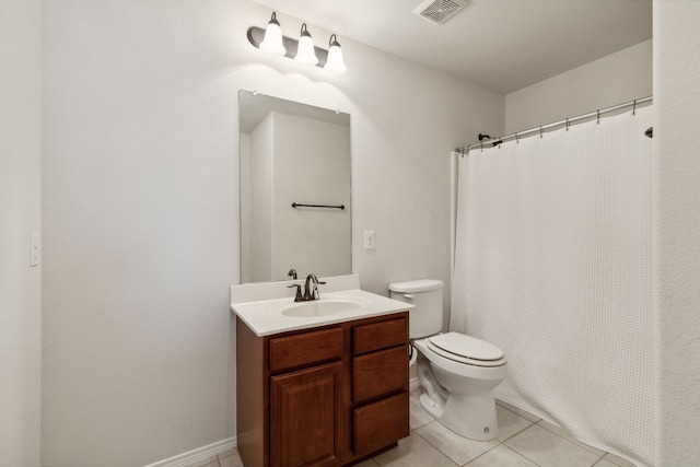 bathroom with vanity, toilet, a shower with shower curtain, and tile patterned floors