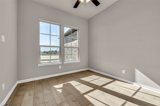 unfurnished room featuring light hardwood / wood-style flooring and ceiling fan