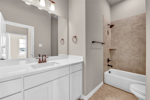 full bathroom with tile patterned flooring, vanity, toilet, and tiled shower / bath