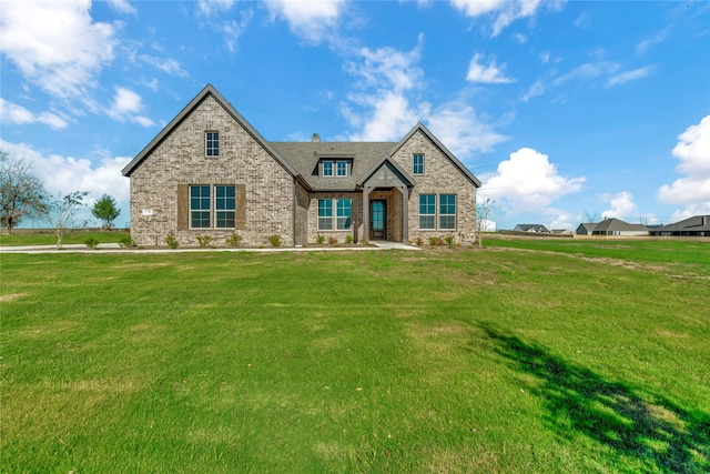 craftsman-style house with a front lawn