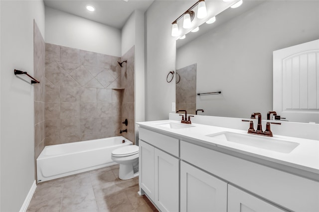 full bathroom featuring tile patterned floors, vanity, toilet, and tiled shower / bath