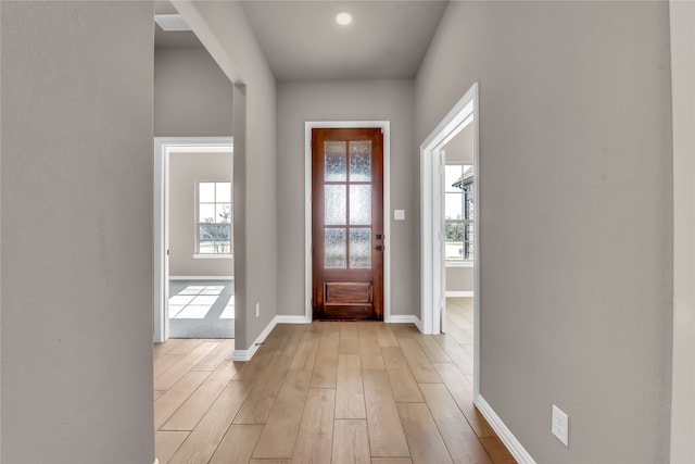 entryway with light hardwood / wood-style flooring