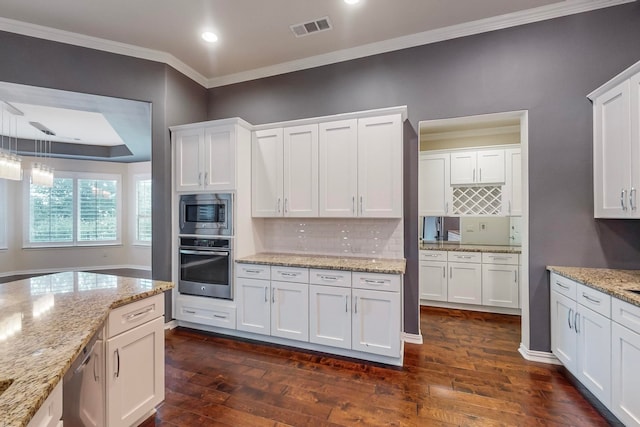 kitchen featuring stainless steel appliances, dark hardwood / wood-style floors, and white cabinetry