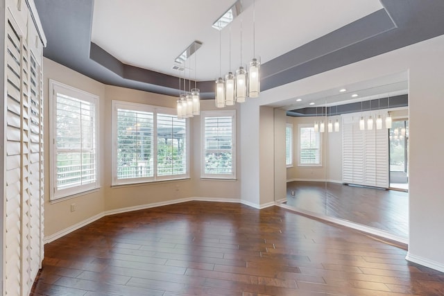 unfurnished dining area with dark hardwood / wood-style floors