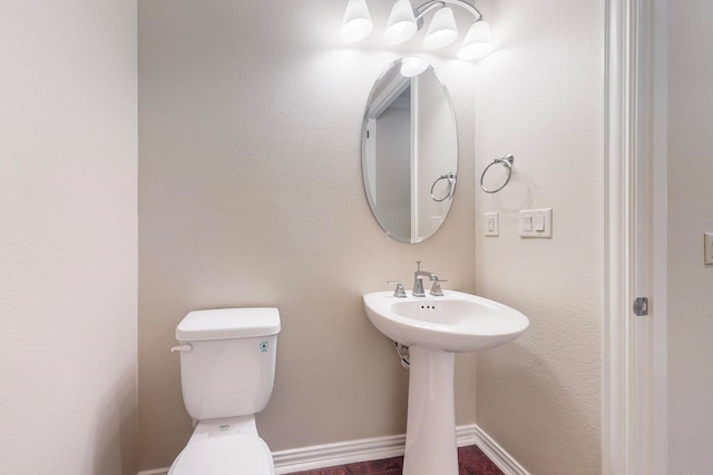 bathroom featuring toilet