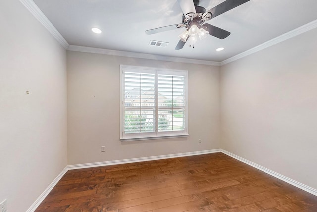 spare room with ceiling fan, ornamental molding, and dark hardwood / wood-style flooring