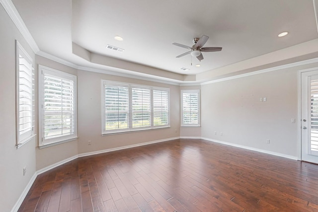 spare room featuring ceiling fan, dark hardwood / wood-style floors, and crown molding