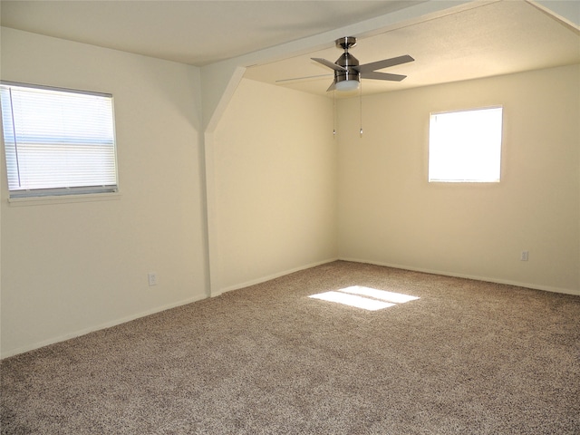 carpeted empty room featuring ceiling fan